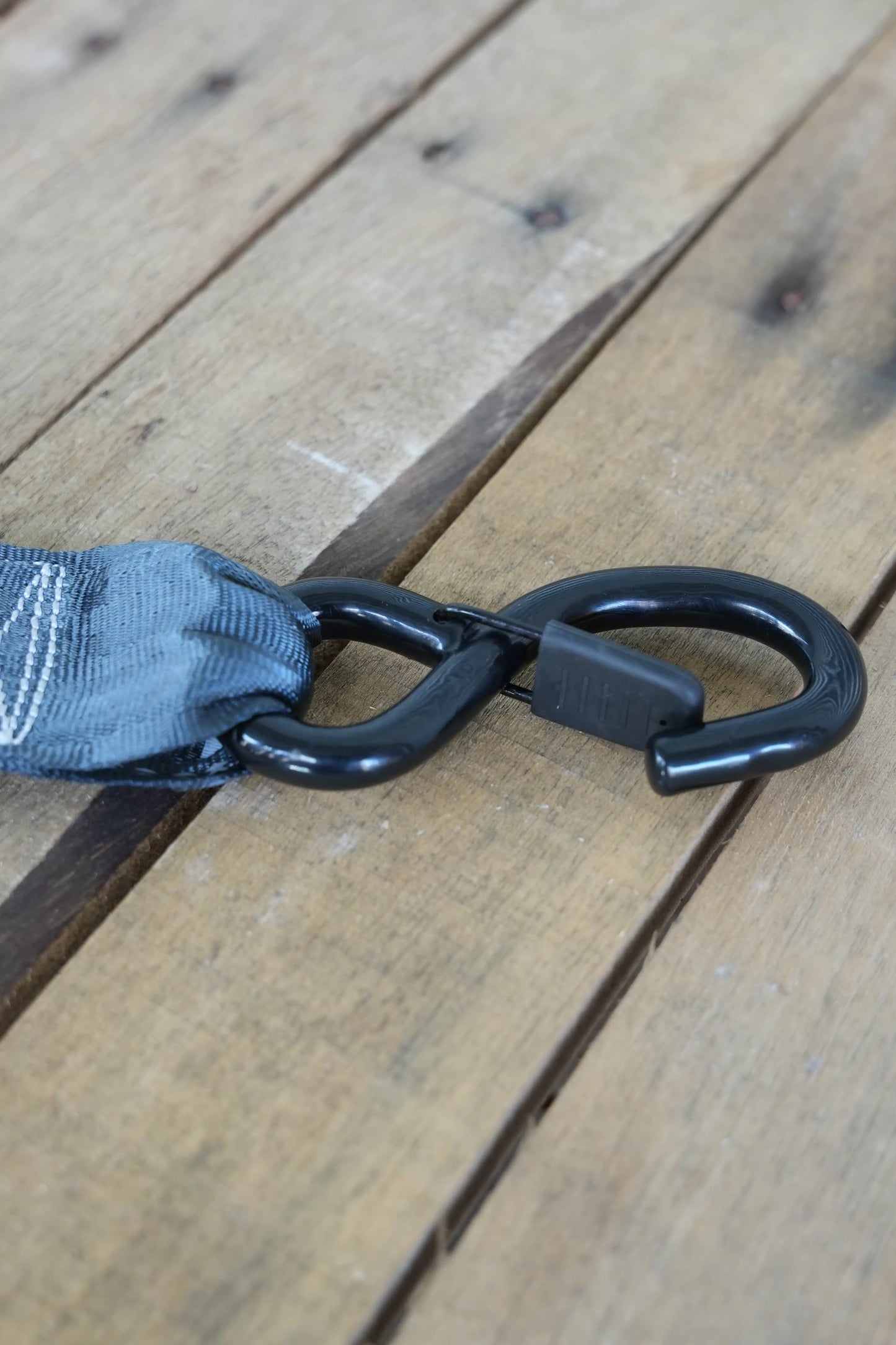 Set of 4 KINETIQ automatic retractable ratchet straps, each 4m long and 50mm wide, with black and orange components.