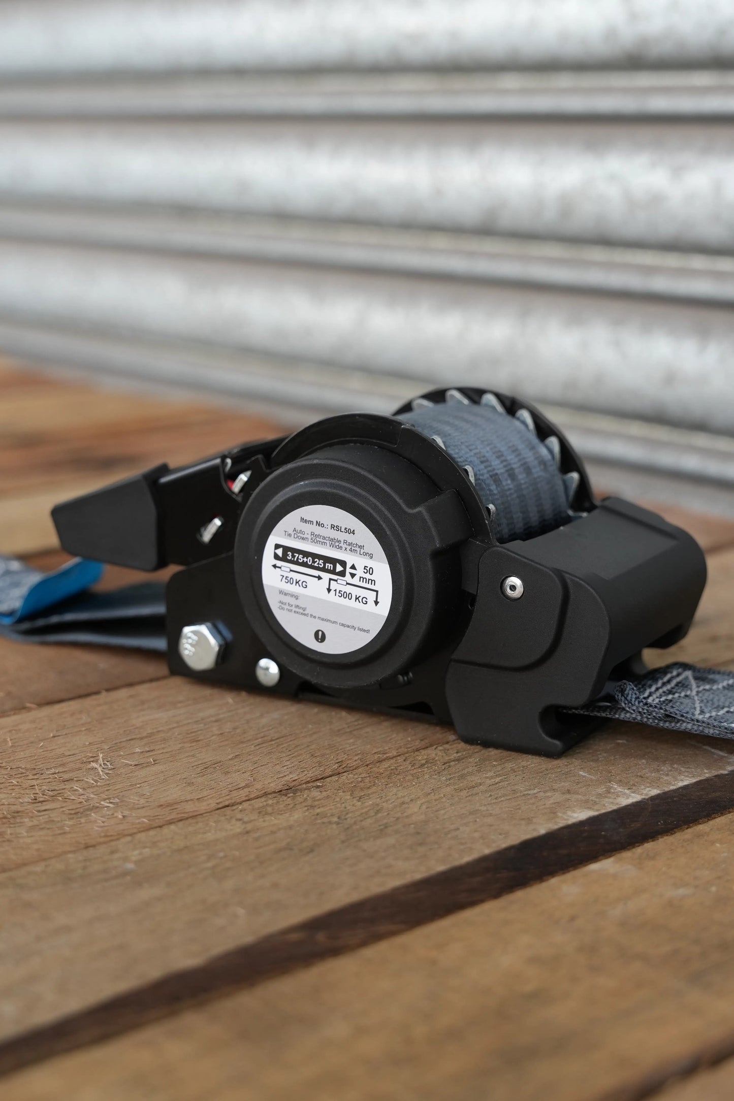 KINETIQ Automatic Retractable Ratchet Strap, 4m long and 50mm wide, with a black and orange ratchet mechanism and sturdy strap.