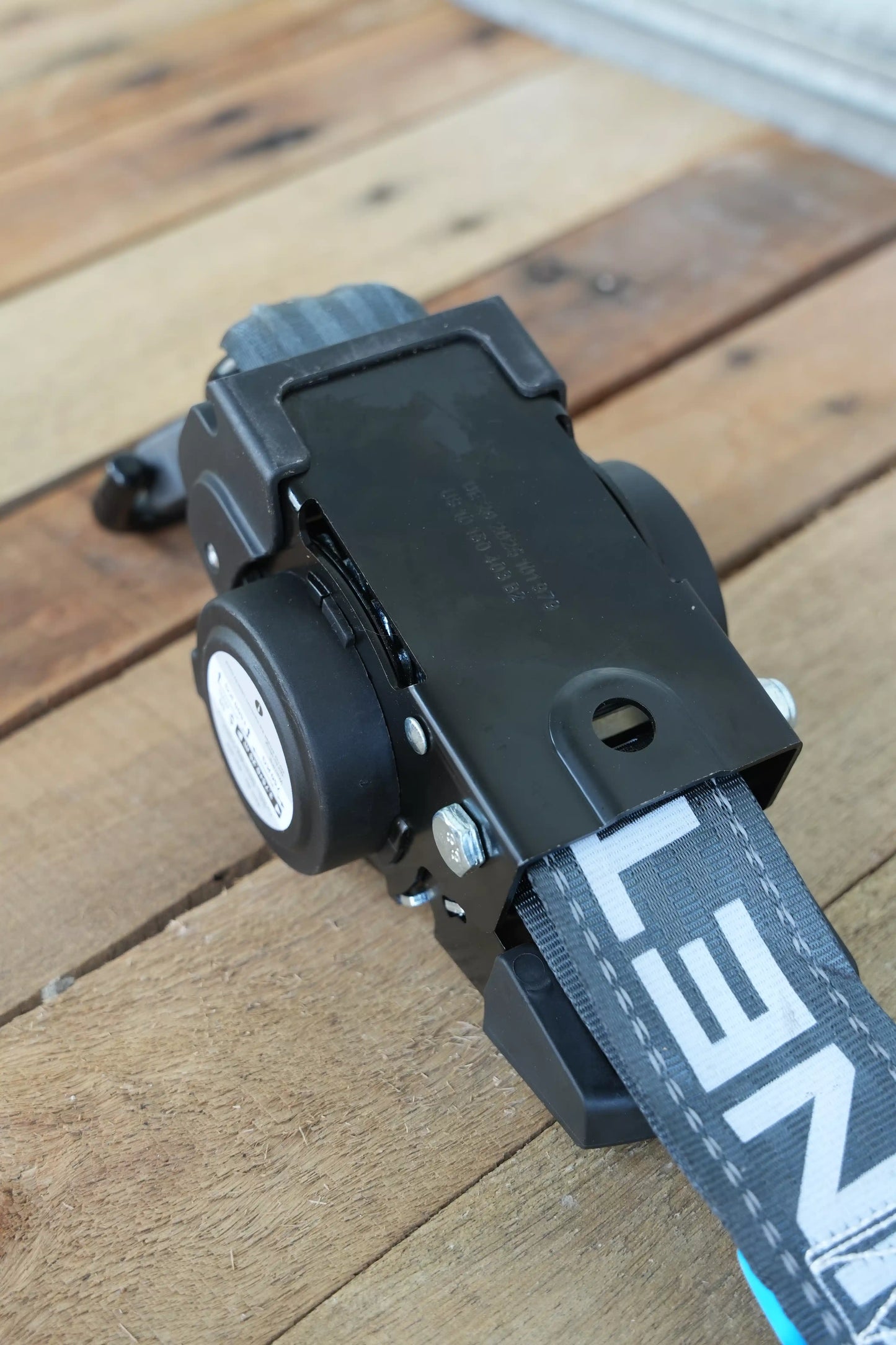 KINETIQ Automatic Retractable Ratchet Strap, 4m long and 50mm wide, with a black and orange ratchet mechanism and durable strap.