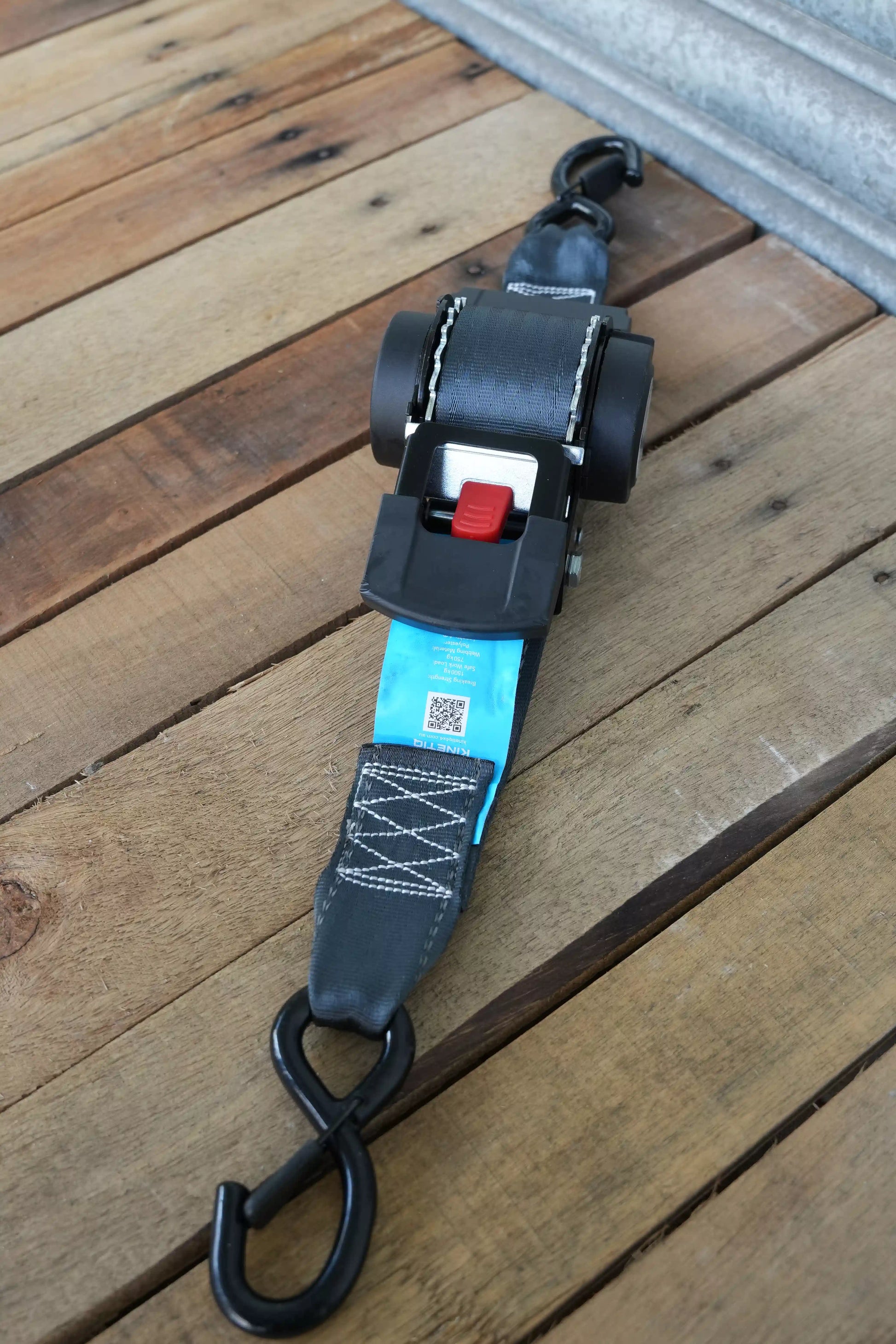 KINETIQ Automatic Retractable Ratchet Strap, 4m long and 50mm wide, with a black and orange ratchet mechanism and sturdy strap.
