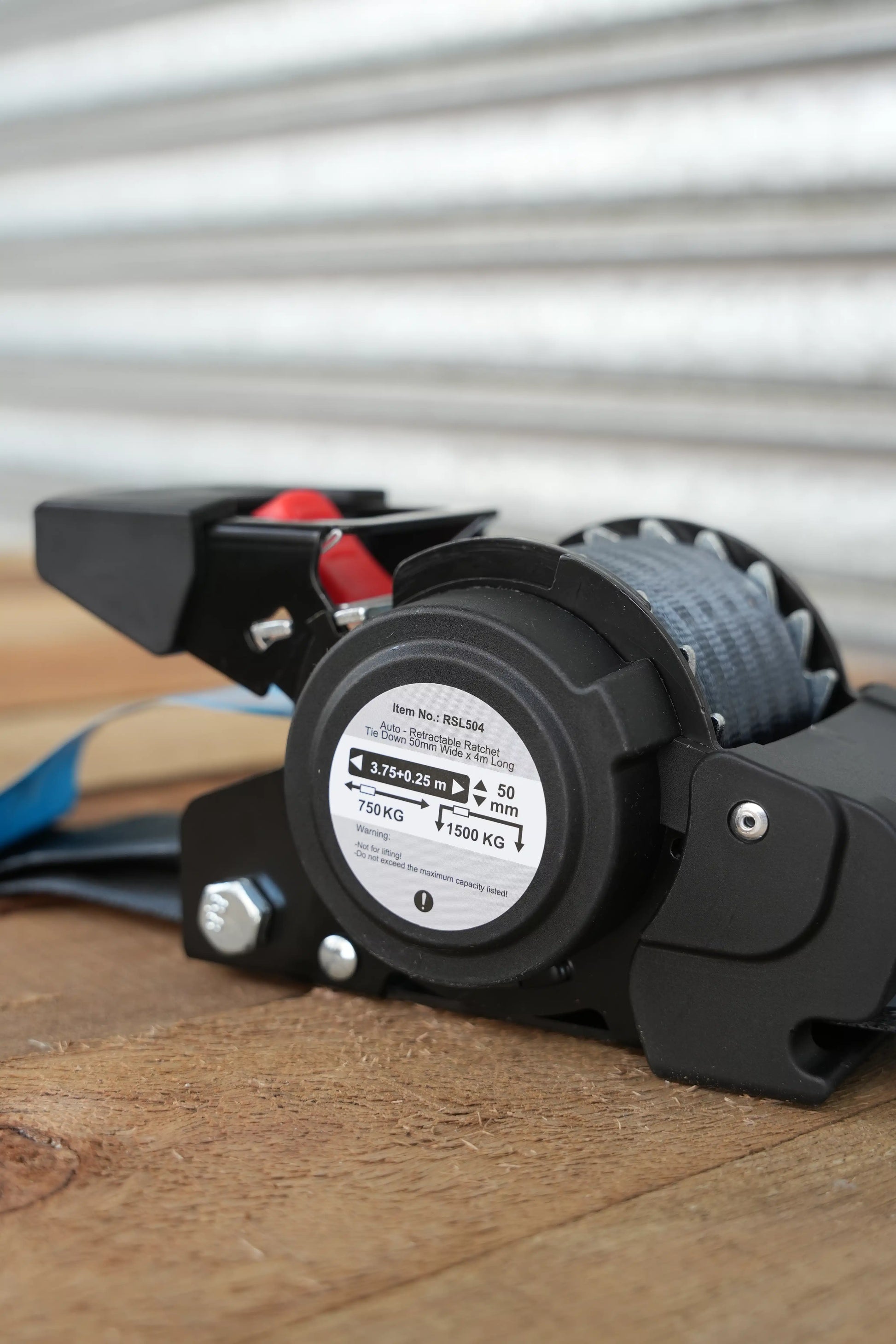 KINETIQ Automatic Retractable Ratchet Strap, 4m long and 50mm wide, with a black and orange ratchet mechanism and durable strap.