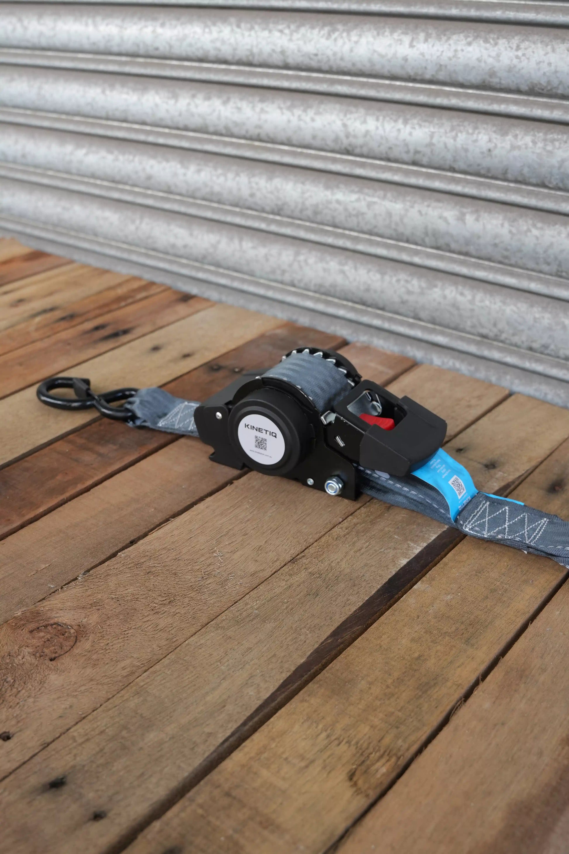 Set of 4 KINETIQ automatic retractable ratchet straps, each 4m long and 50mm wide, with black and orange components.