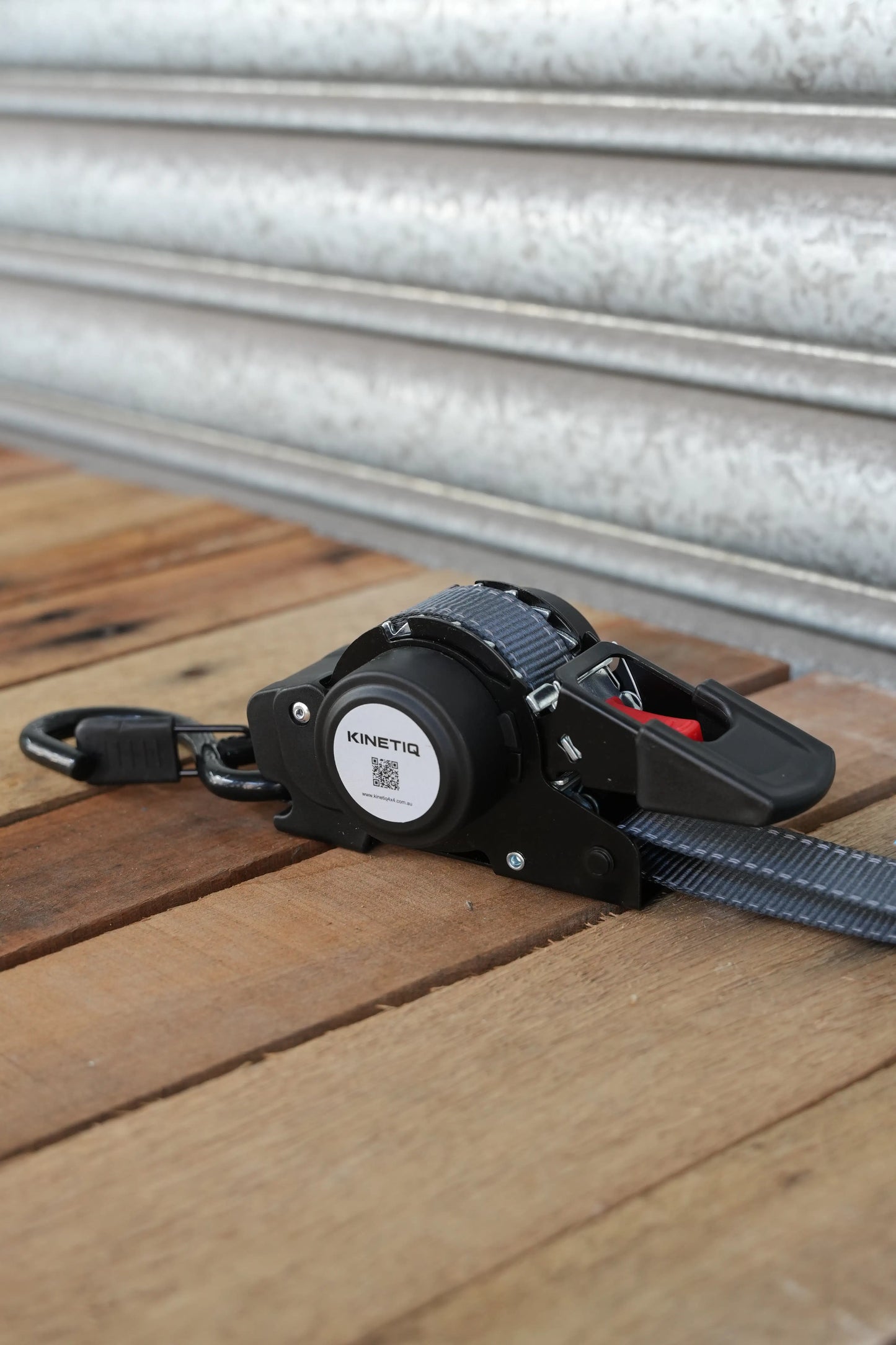 Set of 2 KINETIQ automatic retractable ratchet straps, each 3m long and 25mm wide, with black and orange components.