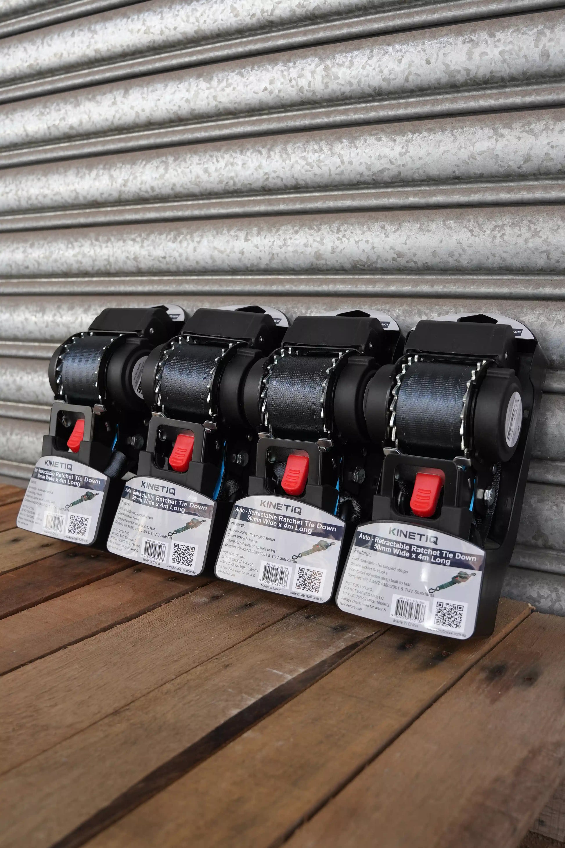 Set of 4 KINETIQ automatic retractable ratchet straps, each 4m long and 50mm wide, with black and orange components.